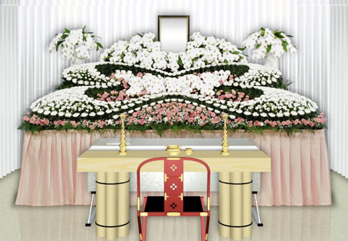 葛飾区メモリーホーム新小岩の祭壇の写真。ピンクと白の花が調和する落ち着いたデザインの祭壇。